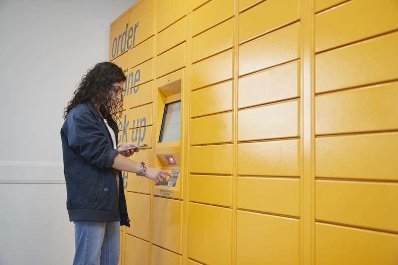 Person standing in front of amazon lockers