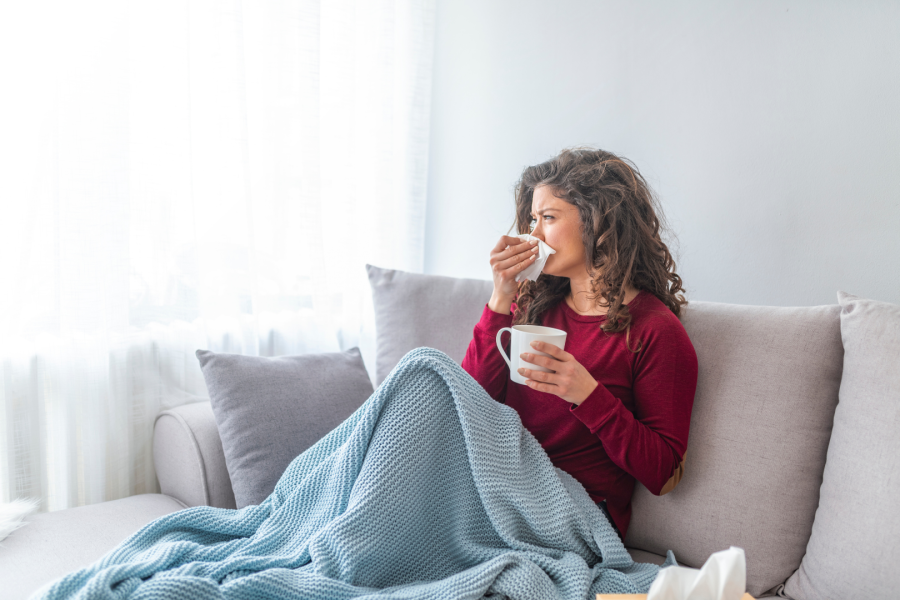 A person on the sofa seemingly unwell 