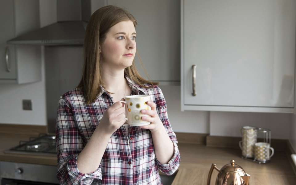 Woman looking out of window