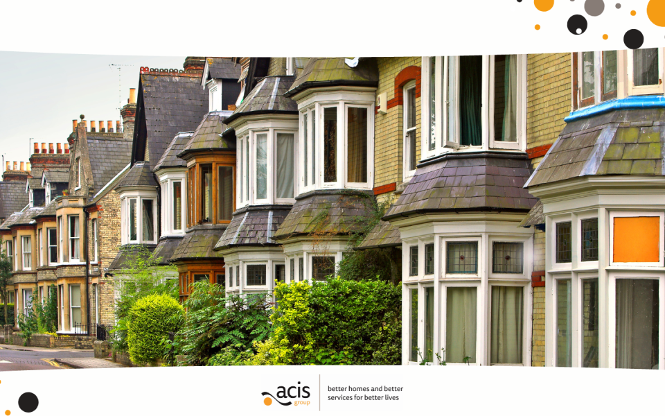 A row of terraced houses on a street