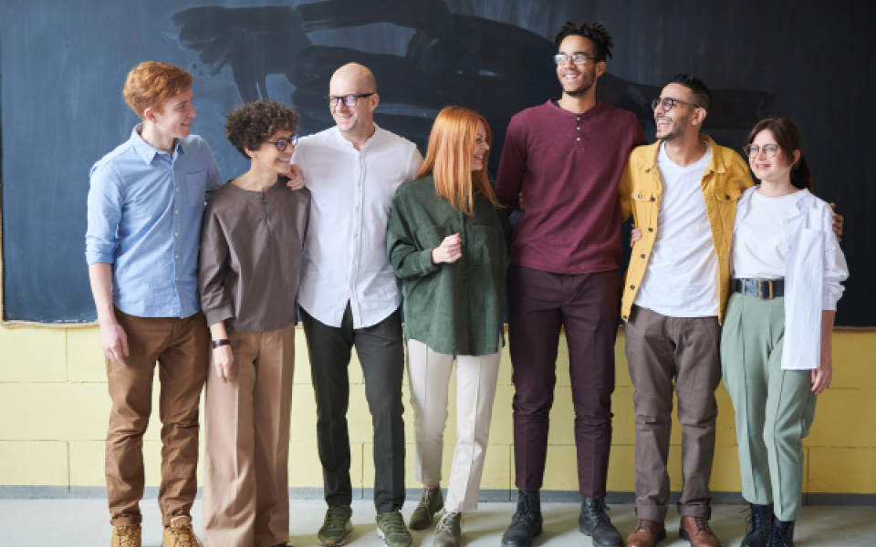 A group of people smiling at the camera. 