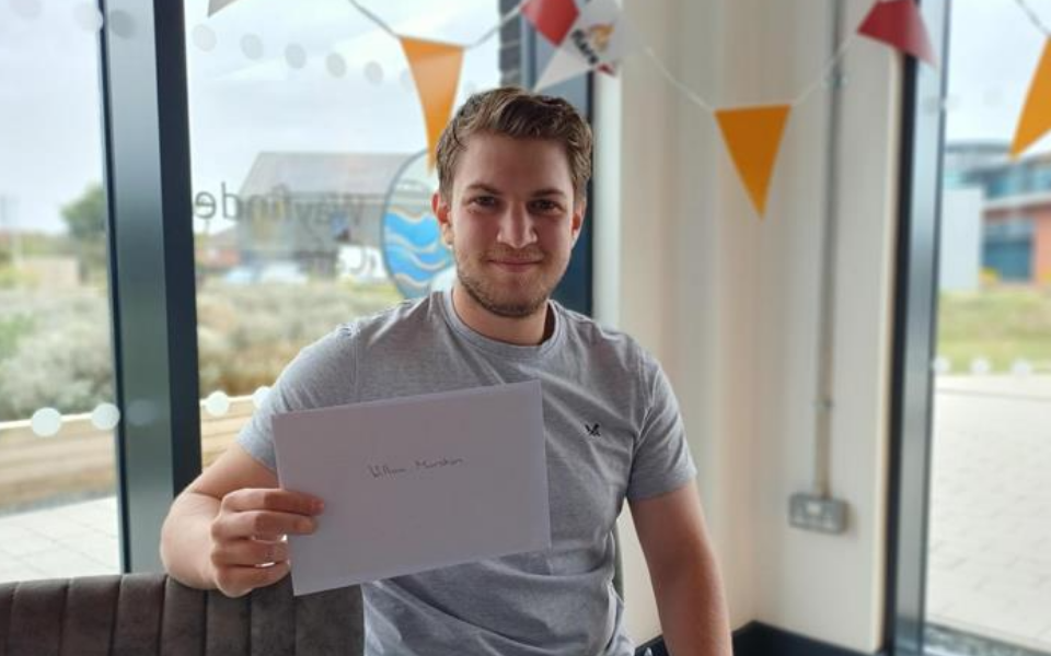 A Flare student showing their GCSE results at Clip Mablethorpe