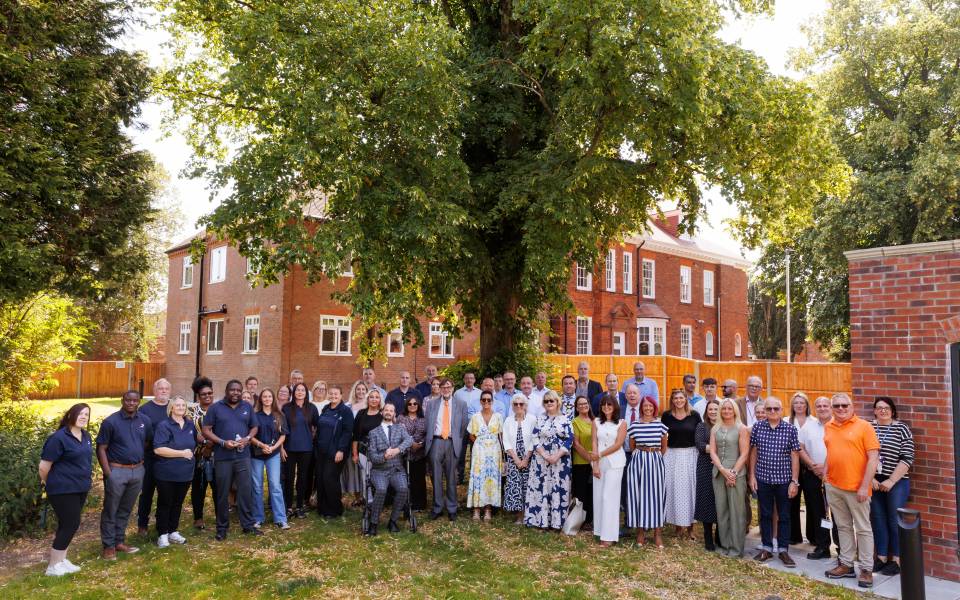 A group of people gather at Grange House in Market Rasen to celebrate the opening of Acis Group's Grange Collective