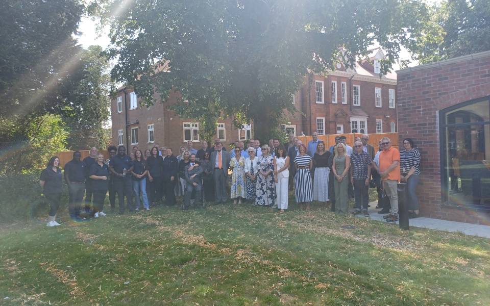 A group of people gather at Grange House in Market Rasen to celebrate the opening of Acis Group's Grange Collective