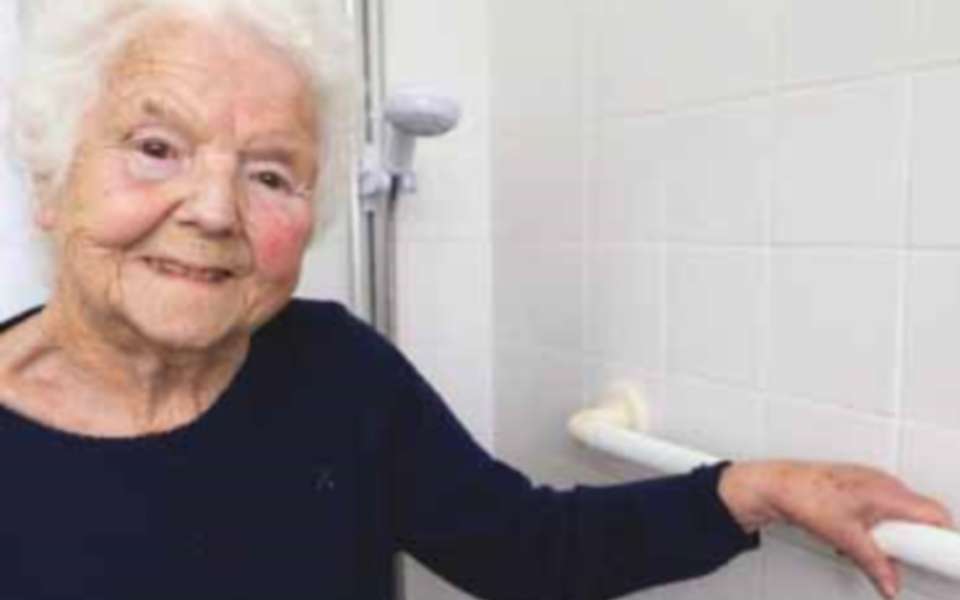 Elderly woman infront of shower