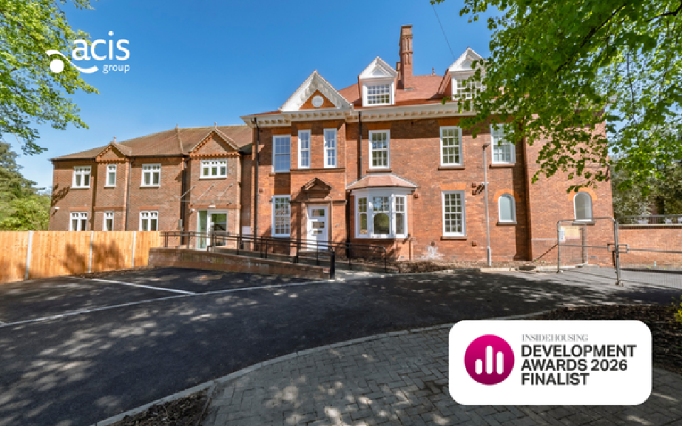 A photo of a large house with Acis Group logo and Inside Housing Development Awards logo