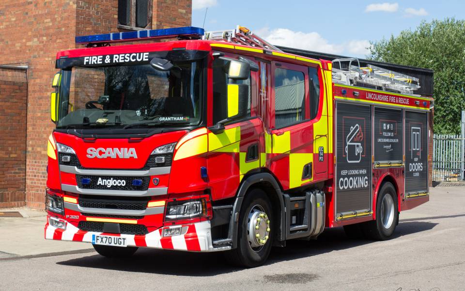 A fire engine leaving the station