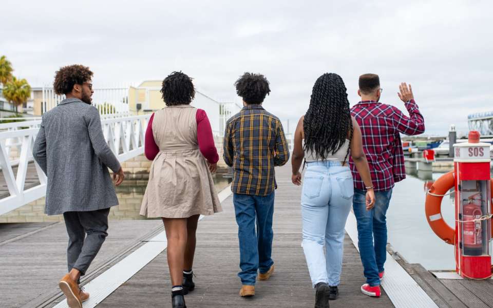 A group of people  walking away